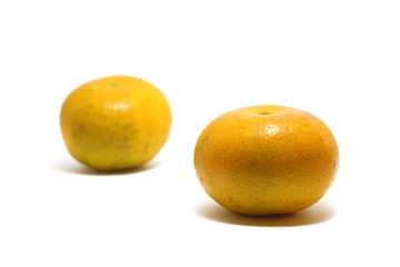 Two sweet oranges (Citrus sinensis) isolated on white background, perfect for breakfasting during ramadan
