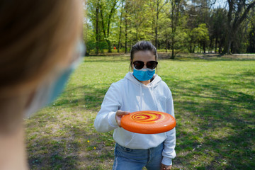 coronavirus, park, health, mask, protective mask, frisbee, fun, background, throw, girl, active,...