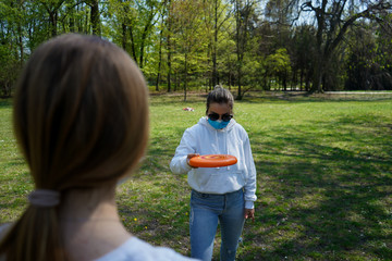 coronavirus, park, health, mask, protective mask, frisbee, fun, background, throw, girl, active,...
