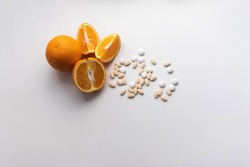 oranges and vitamins tablets pills