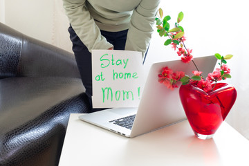 stay home mom laptop spring flowers apple branch pink hand page blank coronavirus covid 19