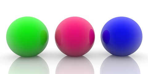Three toy balls of different colors