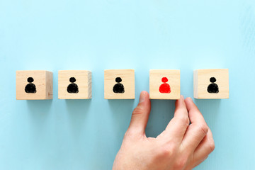 image of wooden blocks with people icons over wooden table ,human resources and management concept