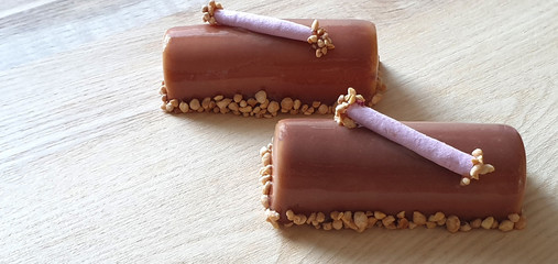 Homemade mousse dessert with nuts, decorated with merengue. .Rustic background. Close up