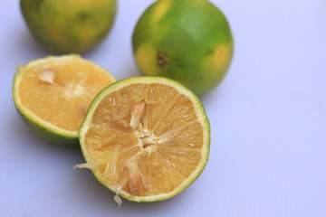 Naklejka na ściany i meble Yellow and green color whole ripe Sweet lime fruits or Citrus limetta
