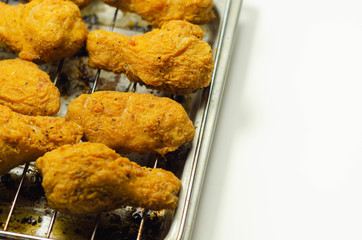 Southern crispy battered fried chicken wings, deep-fried chicken wings on the metal tray