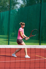 Female tennis player preparing to hit a backhand