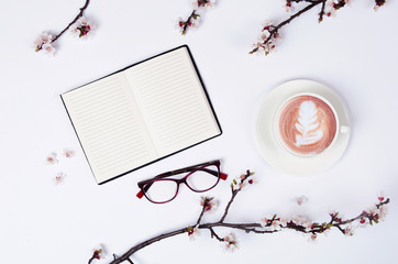wish list for future plans. flat lay composition with flowers,notepad and coffee