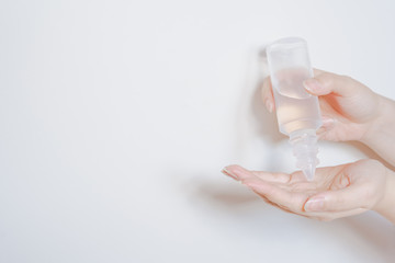 clean and protect COVID-19 virus activity from woman hand during use alcohal gel with white isolated background