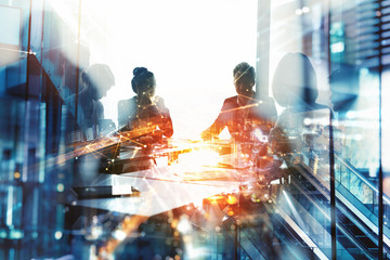 Background concept with business people silhouette at work. Double exposure and light effects