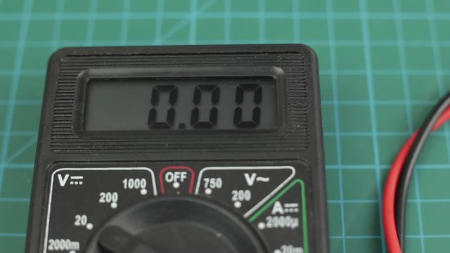 Electronic multimeter tool power on. And measuring voltage test. Close up