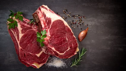 Rolgordijnen Raw T Bone steak on wooden board prepared to Grill  © FreeProd