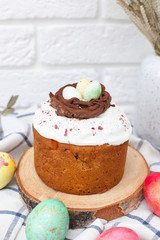 Happy easter. Festive table with delicious panettone and colorful eggs with place for text.