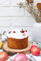 Happy easter. Festive table with delicious panettone and colorful eggs, close-up