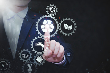 Business people press the button recycle on the virtual touch screen recycle concept and Concept of electric power saving campaign 