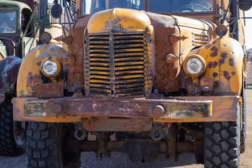 Military style transport truck rusting in the desert