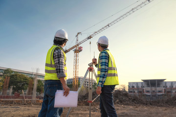 Civil engineer inspects work using radio communication with the management team in the construction...