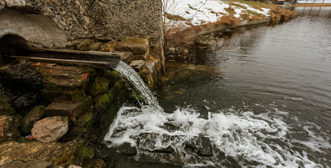 Draining dirty technical waste water in urban public park lake for recreation. Poisoning urban...