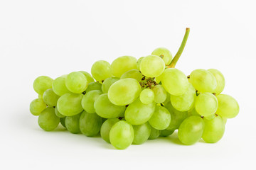 One bunch of ripe organic white grapes isolated on white background, side view

