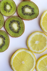 kiwi and lemon slices on a white background with natural light