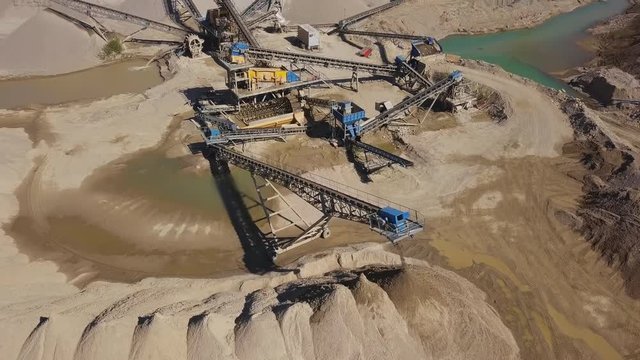 Flight over of crushed stone quarry machine.