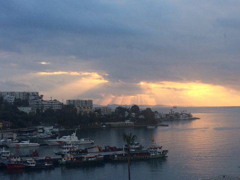 Gulluk, Mugla, TURKEY - 14 September 2017: Amazing golden sunset over the pier. Golden romantic hours.