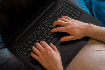 top view of human hands typing on laptop, wireless communication concept