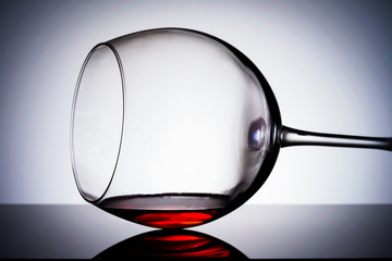 Overturned  wine glass  with wine inside