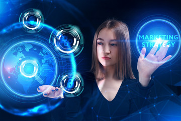 Business, Technology, Internet and network concept. Young businessman working on a virtual screen of the future and sees the inscription: marketing strategy