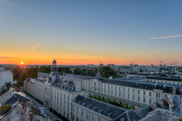 Fototapeta na wymiar vue aérienne des toits de la vielle ville de Nantes en France au lever du soleil