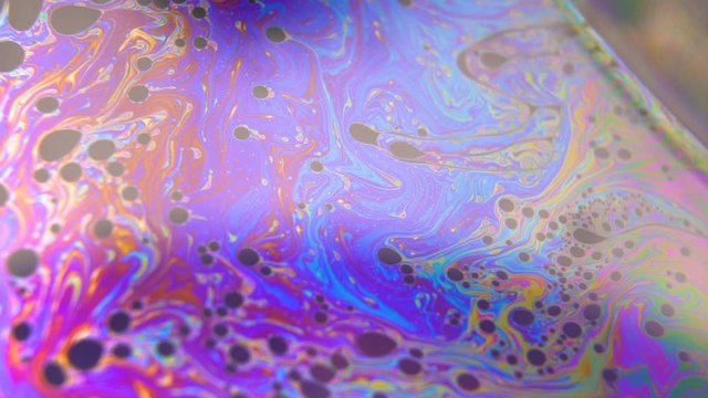 Purple and Blue colored fluid flowing moving creating Bubbles. Abstract fantasy background