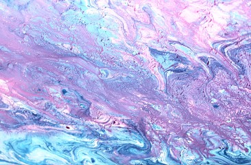 Abstract lilac-pink marble background. Acrylic paint flows freely and creates an interesting...
