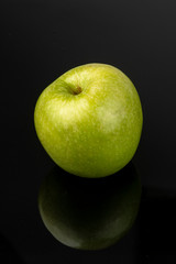 green apple on black