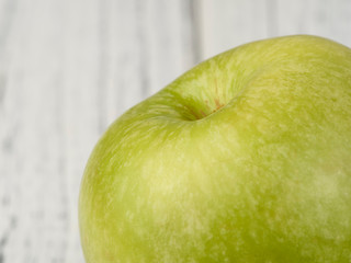 green apples on a wooden table