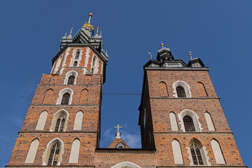 Beautiful Basilica of St. Mary's (XIII century) in historical center of Krakow - Market Square (Rynek Glowny). Krakow, Poland.