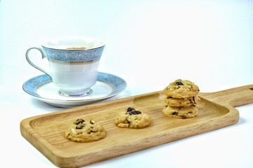 Butter cookies with milk and tasty and delicious beverages are placed on wooden trays to serve...