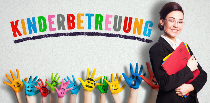 German message for DAYCARE on a wall with a teacher and painted kids hands
