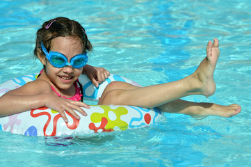 Portrait of happy girl on water slide