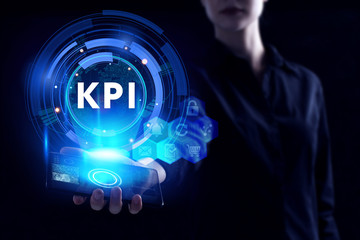 Business, Technology, Internet and network concept. Young businessman working on a virtual screen of the future and sees the inscription: KPI
