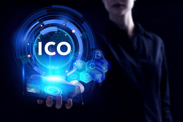 Business, Technology, Internet and network concept. Young businessman working on a virtual screen of the future and sees the inscription: ICO