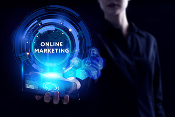 Business, Technology, Internet and network concept. Young businessman working on a virtual screen of the future and sees the inscription: Online marketing