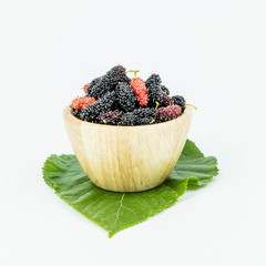 Mulberrys fruit. Close up of fresh mulberry fruit in a wooden cup