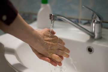 Adult woman washing hands with antibacterial soap. Hygiene concept. Prevent the spread of germs and bacteria and avoid infections corona virus - 341430849