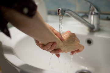 Adult woman washing hands with antibacterial soap - 341431002