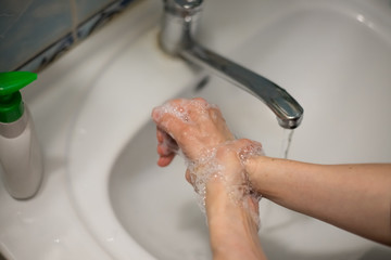 Adult woman washing hands with antibacterial soap. Hygiene concept. Prevent the spread of germs and bacteria and avoid infections corona virus - 341431049
