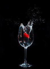 Splashing fruits in to glass of water