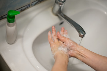 Adult woman washing hands with antibacterial soap. Hygiene concept. Prevent the spread of germs and bacteria and avoid infections corona virus - 341431092