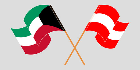Crossed and waving flags of Kuwait and Austria