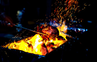 Fototapeta na wymiar Lighting of fire for barbeque grill
