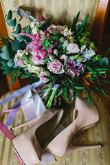 bridal shoes and bouquet